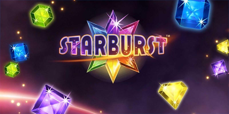 Starburst game logo at the center, surrounded by vibrant, glowing gemstones in green, blue, purple, yellow, and orange hues. The background features a dark, cosmic space theme with subtle star-like sparkles, creating a dynamic and colorful atmosphere.